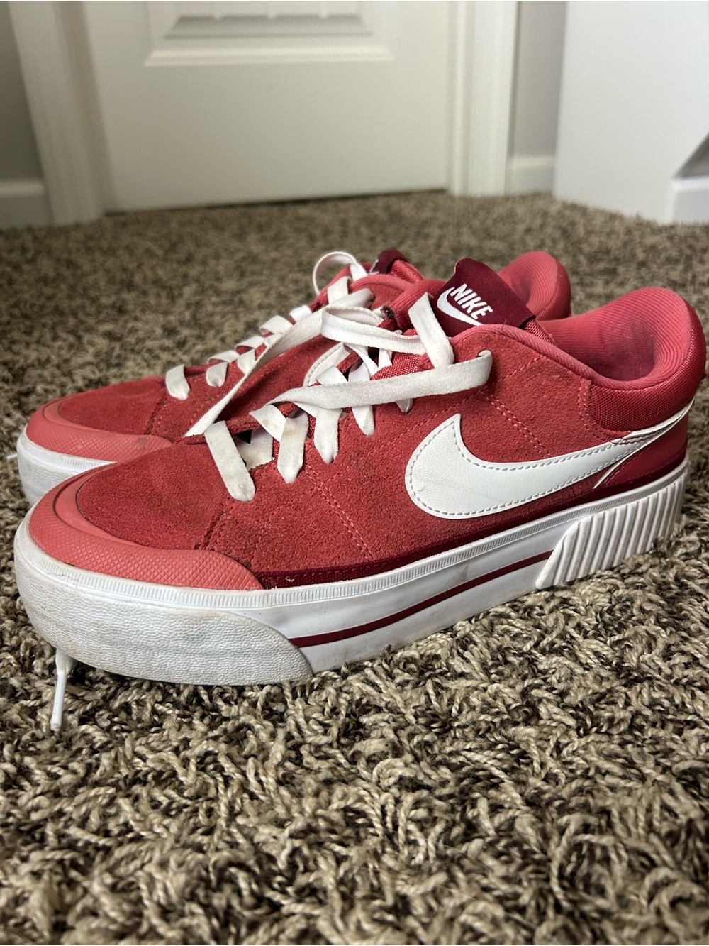 Nike Women’s Red Suede Low-Top Sneakers with White Swoosh